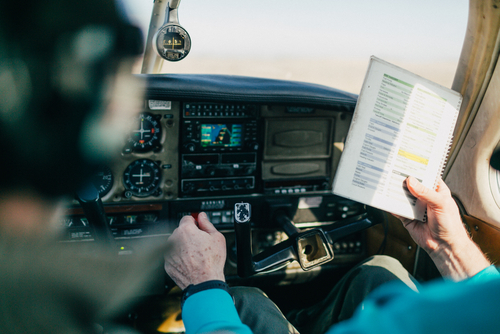 Flight,instructor,and,student,reviewing,flight,checklist