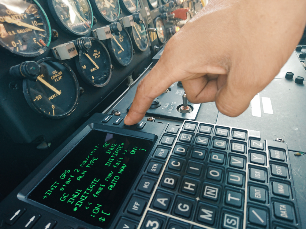 Hand,of,aircraft,mechanic,press,the,push,bottom,for,operation