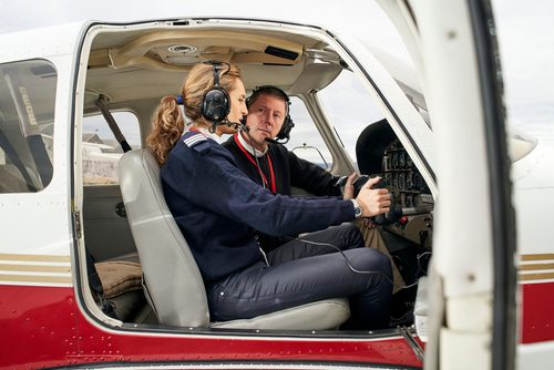 Pilot,in,training,and,flight,instructor,in,the,cockpit,of